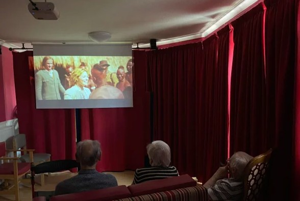 residents watching a film in the cinema room