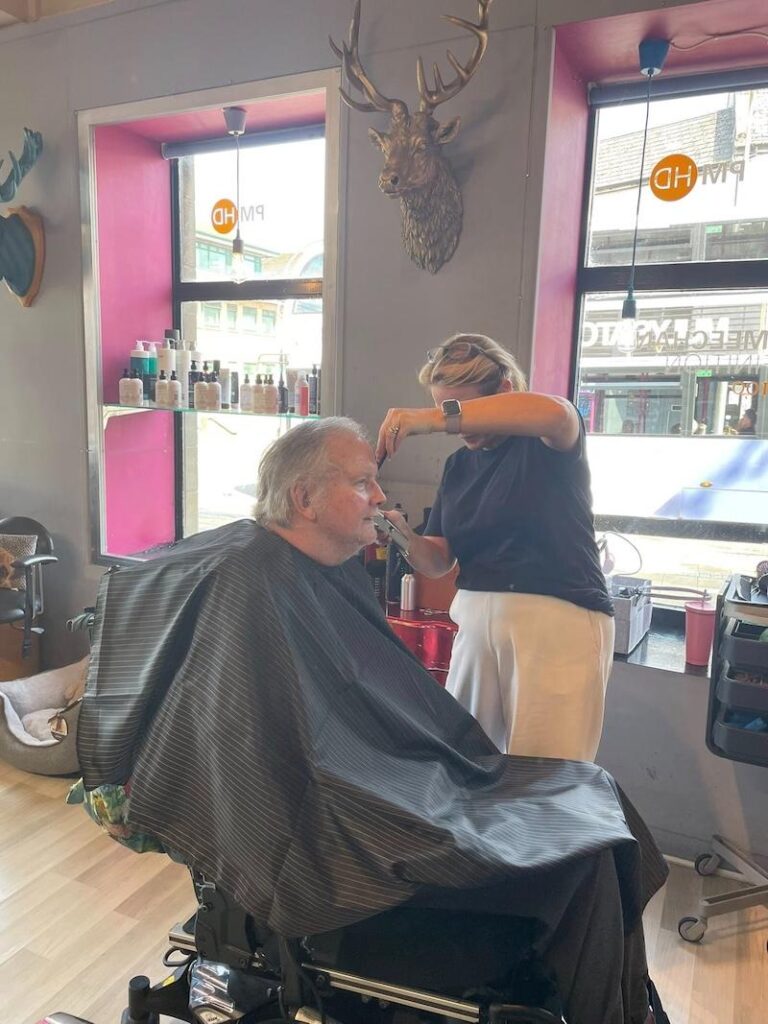 one of our residents getting their haircut