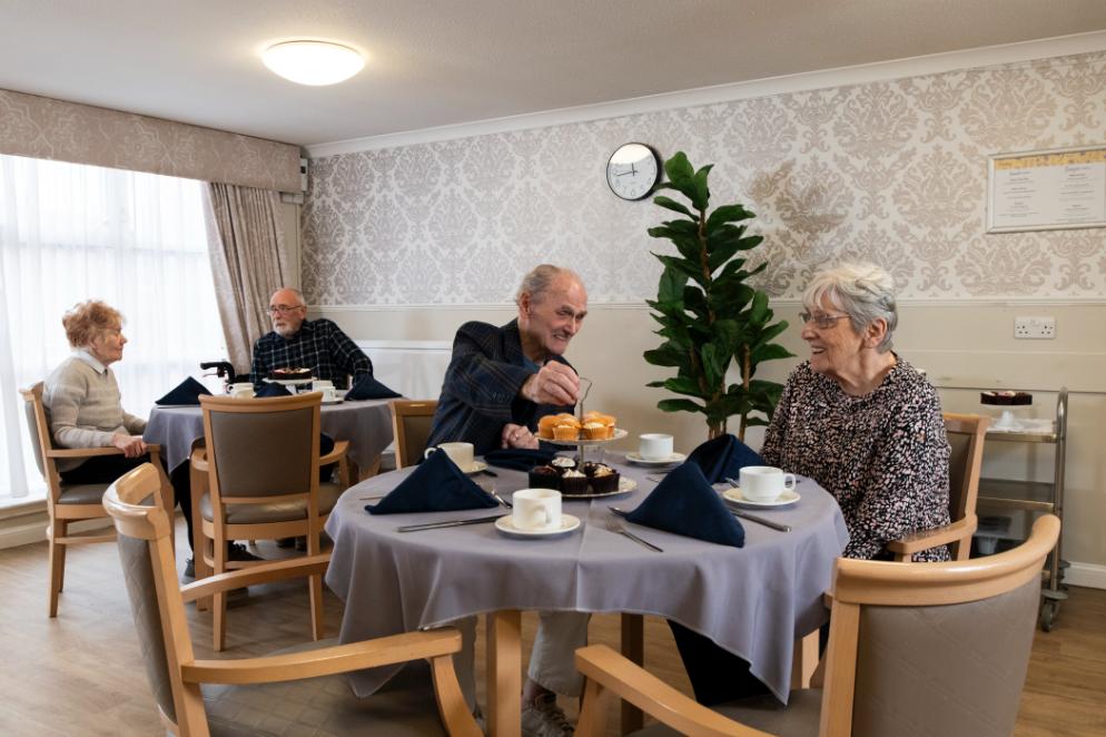 Residents enjoying food in the dining area at Campsie View