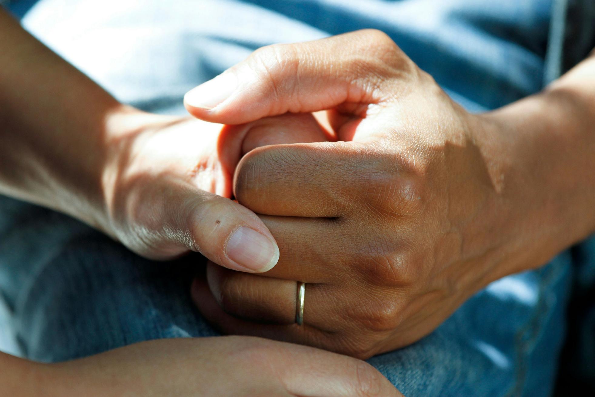 Holding hands with elderly resident