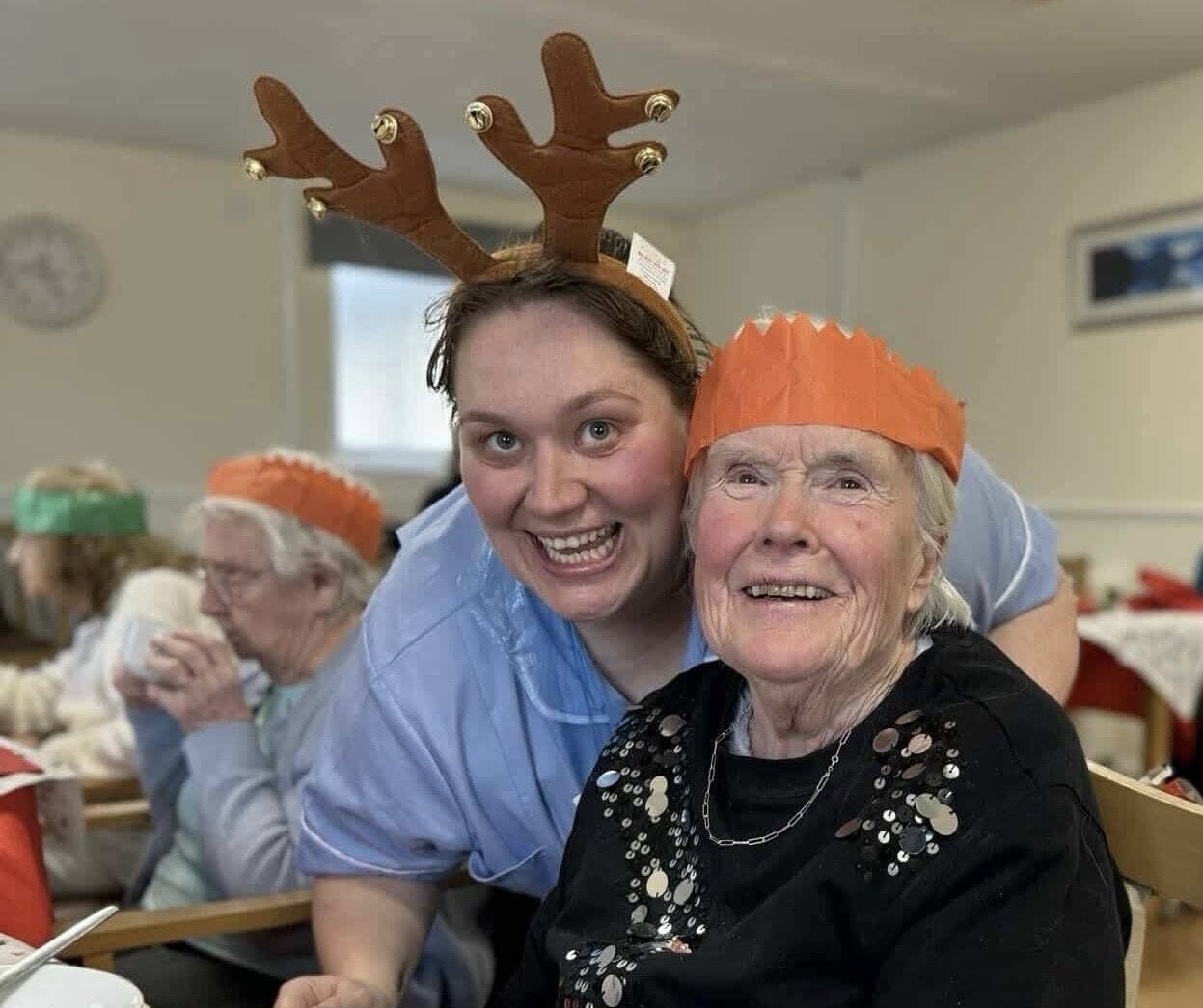 resident and carer at Campsie View care home christmas dinner