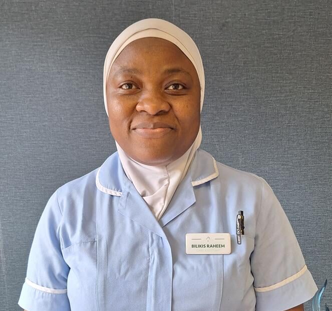 woman in light blue nurse uniform