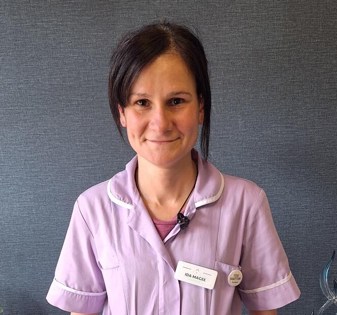 woman in lavender nurse uniform