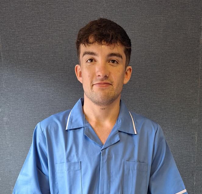 man in blue care home uniform